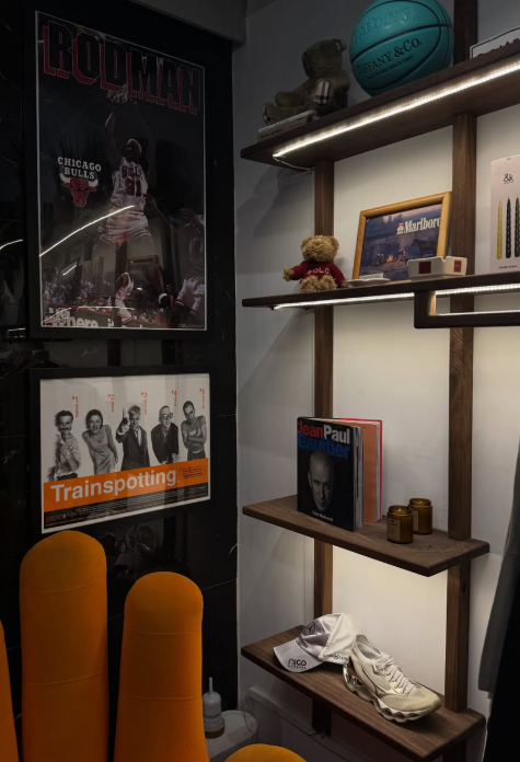 Framed prints and objects on shelves in an interior